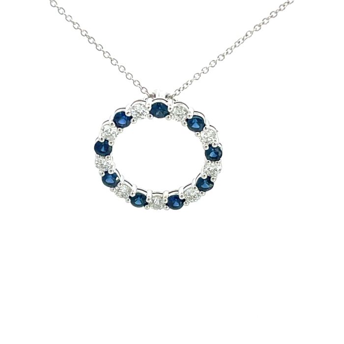 14K White Gold Circle Pendant with 0.65ctw Diamonds and 0.85ctw Sapphire 14K White Gold Circle Pendant with 0.65ctw Diamonds and 0.85ctw Sapphire