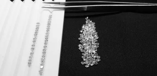 large diamond engagement ring on pink background